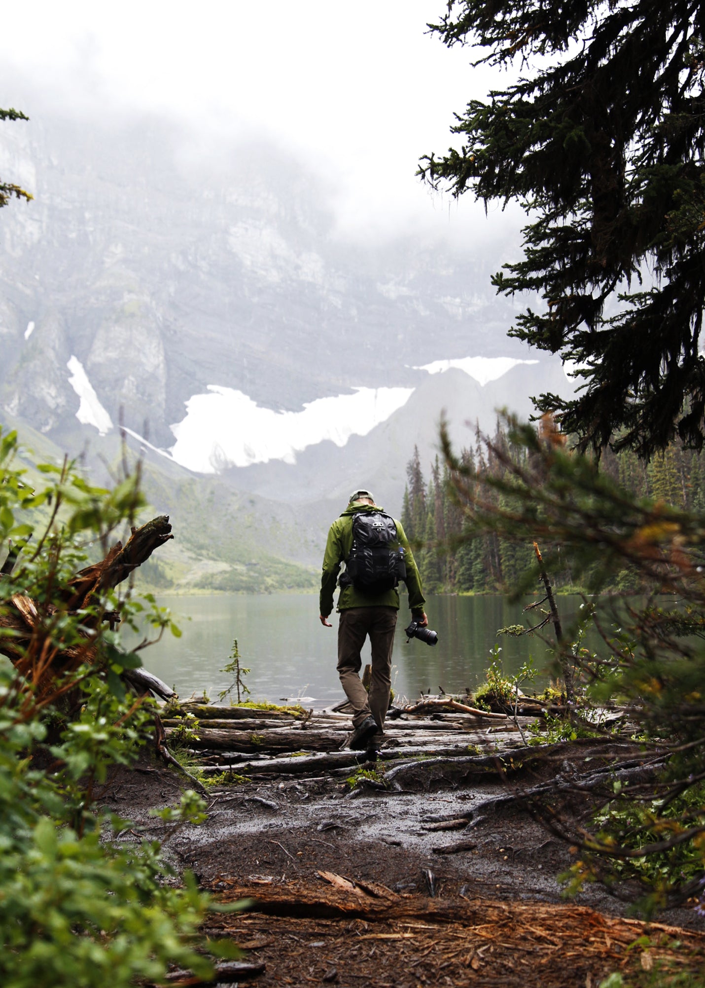 male hiker walking in rain